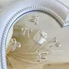 Acessórios de liga para nail art personalizados, laços de macaron, decorações metálicas de unhas vestíveis DIY, atacado em grandes quantidades