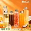 Venta directa de fábrica botella de vidrio de borosilicato alto botella de agua portátil con tapa de acero inoxidable botella de vidrio para infusión botella transparente para bebidas y jugos