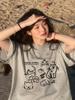 Camiseta Blanca de Algodón Pesado de Manga Corta con Estampado de Dibujos Animados para Mujer 2025 Nueva Superior de Longitud Media Holgada con Efecto Adelgazante