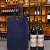 Directamente del fabricante: Bolsa de regalo de fieltro color vino tinto con cierre de broche, bolsa de almacenamiento de fieltro personalizable, bolsa de vino portátil