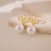 Brincos Grandes de Pérola Simples Estilo Coreano com um Toque Vintage, Design Versátil de Nicho, Luxo Leve e Sensação de Alta Qualidade