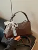 Nuevo bolso tejido de alta costura transfronterizo 2026, diseño elegante, bolso tote pequeño para salir, bolso de hombro y cruzado para mujer