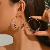 Pendientes de Venta Caliente Transfronterizos en Varios Estilos de Europa y América, Pendientes de Diseño Exagerado de Gama Alta de Círculo Metálico con Forma de Flor en Stock