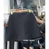 Calça saia de lã versátil cinza para mulheres um pouco cheinhas, design de cintura alta espessado para primavera e outono de 2026, calça saia solta emagrecedora