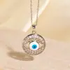 Colar Olho de Diabo Transfronteiriço para Mulheres, Cobre Banhado a Ouro com Incrustação de Zircônia, Relevo Tridimensional com Gotejamento de Óleo, Pingente Irregular de Pupila Azul, Moda Europeia e Americana