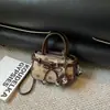 Bolso retro de lunares de nicho a la moda 2026 nuevo bolso cruzado casual para mujer bolso de mano elegante exquisito y único