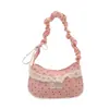 Bolsa de poá de nicho super popular para mulheres, nova moda 2026, bolsa versátil de ombro e axila, pequena bolsa de mão requintada