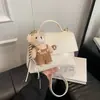 Bolsa de mão pequena transfronteiriça da moda para mulheres, novo modelo 2026, bolsa de mão estilosa para sair, bolsa quadrada pequena versátil, bolsa tiracolo