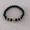 Venta caliente transfronteriza nueva 8 mm piedra negra esmerilada cabeza de leopardo dorada antigua plata cabeza de león pulsera elástica para hombres y mujeres venta al por mayor
