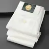 Nuevo Estilo Lujo Ligero Negro Antidesvanecimiento Blanco Triple Protección Jeans de Estiramiento en Nueve Puntos Pantalones Casuales para Hombre Pantalones Rectos Ajustados de Moda