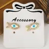 Venta caliente transfronteriza pendientes pequeños y exquisitos de ojo de diablo personalidad retro francesa nicho creativo pendientes de hip-hop joyería