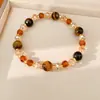 Pulsera de cuentas de ojo de tigre, sensación de lujo ligero de nicho de alta gama, accesorio de mano versátil estilo Maillard