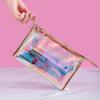 Bolsa de cosméticos transparente de color mágico láser de fábrica, bolsa de almacenamiento portátil avanzada, bolsa de aseo multifuncional, se puede fijar logo