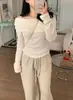 Enviado, tamanho atualizado: Nova coleção outono/inverno chique coreana, gola halter da moda, amarração frontal, plissado, em camadas, camiseta de manga longa de um ombro