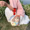 Venta al por mayor del fabricante Bolso de mano artístico de moda Bolso de lona Bolso tipo cubo de gran capacidad para mujer 2026 Nuevo Bolso para almuerzo de trabajo