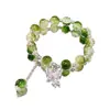 Nueva pulsera de esmalte de mariposa femenina ins nicho lujo ligero Mori azul marino cuentas de colores craqueladas hielo pulsera de amigas al por mayor