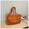 Atacado transfronteiriço nova bolsa de ombro única de lona de nicho de alta qualidade bolsa de axila casual para o dia a dia bolsa transversal simples e moderna