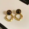 Aretes redondos de estampado de leopardo marrón melardo con incrustaciones de diamantes, estilo retro de otoño e invierno, aretes elegantes, aretes de lujo ligero y de alta gama para mujer