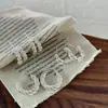 Corea del Sur Hebilla de Oreja Retorcida de Plata Esterlina Pendientes de Círculo Lujo Ligero Diseño de Nicho Pendientes de Círculo Elegantes Nuevos Explosivos 2025