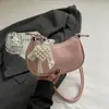 Bolsa de textura para grupo pequeno bolsa feminina bolsa de mão nova de verão 2025 bolsa simples de bolinho moda bolsa de ombro bolsa mensageiro