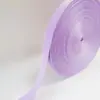 Venta al por mayor de fábrica Cremallera de stock Accesorios para ropa Colorido Nailon de imitación Patrón de hoyuelos Cinta de espiga Tiras decorativas para ropa