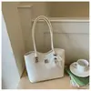 Bolso de hombro con lazo estilo coreano 2026 transfronterizo para mujer, bolso de axila de nicho, bolso tipo cubo moderno y simple para el trabajo diario para mujer
