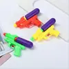 Yiwu Binario venta al por mayor de productos pequeños casa de juegos juguete pistola de agua al por mayor puesto de pistolas de juguete suministro