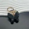 Joyería de Diamante Chica Linda Hebilla de Lazo Personalizada Lujo Ligero Arcilla Pedrería Llavero de Coche con Lazo