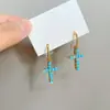 ¡Elegancia vintage! Aretes de cruz turquesa azul, sensación de lujo ligero y alta gama para mujer