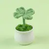 Planta de interior popular de trébol de cuatro hojas artificial, planta verde artificial tejida, artículo decorativo creativo de alto valor, regalo de la suerte, venta al por mayor desde el fabricante