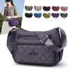 Tendência transfronteiriça nova bolsa feminina bordada multicamadas de nylon de ombro único moderna para mães no trajeto diário bolsa de ombro única feminina casual