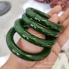 Pulsera de jade al por mayor de fábrica material de Mongolia Exterior imitación alta de jade Hetian pulsera de barra redonda gruesa de jade suministro en vivo de pulsera de jade