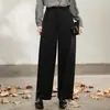 Los nuevos pantalones casuales negros de Sudu para mujer cuentan con costuras tridimensionales, un efecto adelgazante, bolsillos traseros de parche y un diseño holgado de pierna curva adecuado para ir al trabajo.