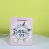 Bolsa de Regalo Blanca de Cartón para el Día de la Madre en stock Venta al por Mayor Plata Caliente 8 de Marzo Día de la Mujer Bolsa de Papel para Envolver Bolsa de Regalo para el Día de las Niñas