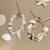 Pulsera trenzada de conchas estilo resort costero bohemio, ajustable con cordón, pequeña, fresca, de moda, de alta gama