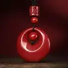 Anillo de madre al por mayor este año colgante para dama hebilla de paz de cinabrio anillo de paz de bajo contenido arena púrpura colgante