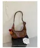 Bolsa de ombro e transversal estilo coreano ins de grande capacidade, retrô, plissada macia em formato de bolinho, casual e versátil