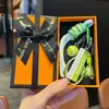 Nuevo Colgante Llavero Serie Deportiva de Tenis Creativo Raqueta Cuerda Trenzada Dopamina Encanto para Bolso Regalo