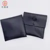 2025 Nueva Bolsa Plegable de Cuero PU Negra Simple Portátil Bolsa para Auriculares Bolsa de Almacenamiento para Joyas y Llaves