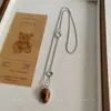 Colar em camadas único de outono e inverno com pedra olho de tigre Maillard, design de luxo leve, corrente longa para suéter, acessório versátil vintage