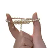 [Riqueza de Todas las Direcciones] Nuevo diseño de nicho pulsera de monedas con diamantes brillantes, una pulsera retro versátil y elegante inspirada en China para mujeres