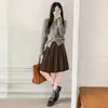 Falda plisada de lana negra para mujer, nueva colección otoño 2026, de cintura alta, estiliza la figura, de longitud media, falda de línea A estilo universitario coreano