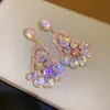 Aretes de aguja de plata con colgante hueco de gota de agua y flor incrustados de diamantes, aretes de estilo corte vintage, aretes de nicho modernos y únicos