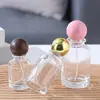 Botella de perfume de vidrio transparente en stock, venta directa, con tapa de bola, botella vacía rellenable de prensa-spray cosmético portátil