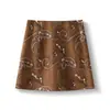 Falda de gamuza bordada jacquard vintage para mujer, otoño, cintura alta, aspecto adelgazante, minifalda Maillard, línea A ajustada a la cadera