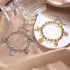 Pulsera Pulsera de Acero Inoxidable en Forma de U con Colgante Múltiple Corazón Cabeza Cruzada Nueva Belleza Cruzada Europea y Americana