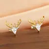Pendientes de Reno de Navidad Exquisitos Cao Shi para Mujer Douyin Nuevo Estilo Navideño Astas Pendientes de Zirconia en Forma de Gota Microincrustada