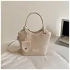 Bolsa de cor sólida com textura tecida de alto valor, novo estilo 2026, bolsa tipo balde da moda, bolsa transversal estilosa, bolsa de mão simples
