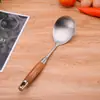 Fabricantes directos acero inoxidable 304 flor de pera madera de haya espátula para cocinar espátula para freír juego de cucharas ranuradas grandes