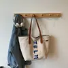 Bolso de Lona Gruesa Bordado con Letras Estilo Harajuku 2025 Nuevo Versátil Casual Gran Capacidad Bolso Tote de Hombro para Mujer